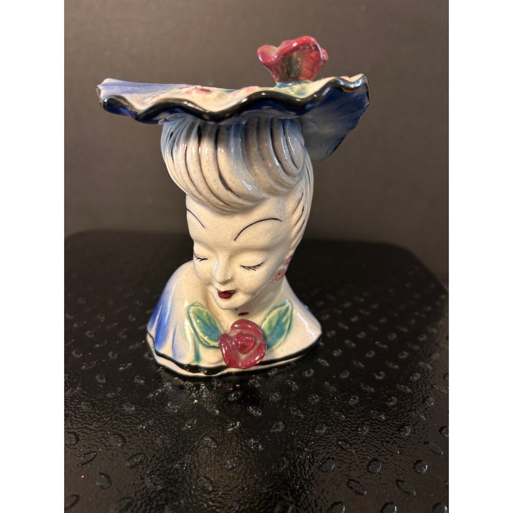 vintage lady head vase - a stylish lady in a blue hat adorned with a red rose.